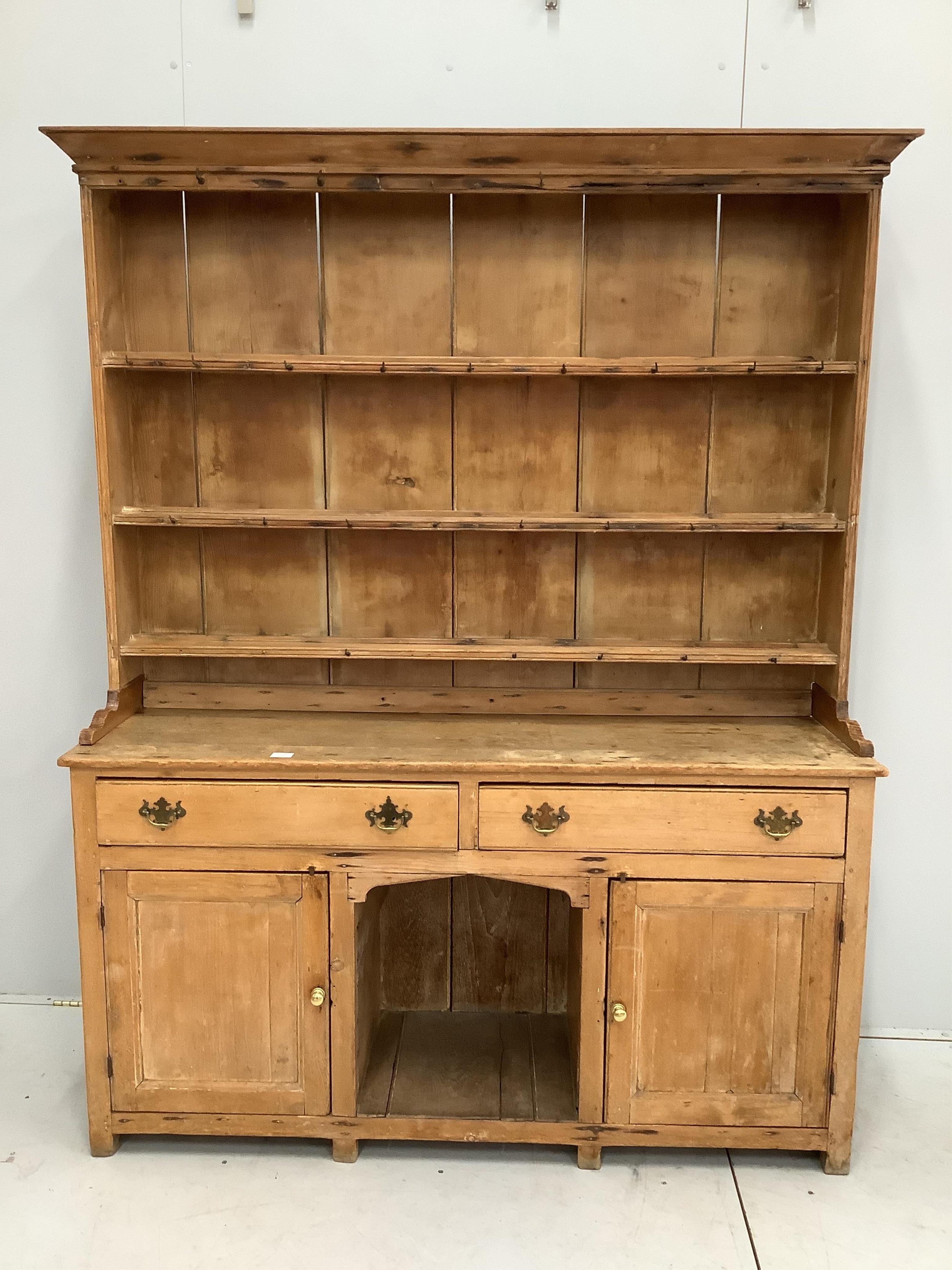 A Victorian stripped pine 'dog kennel' dresser with boarded rack, width 156cm, depth 44cm, height 200cm